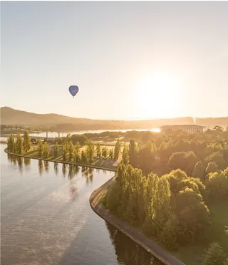 Sunrise over Lake Burley Griffin, Canberra, with a hot air balloon