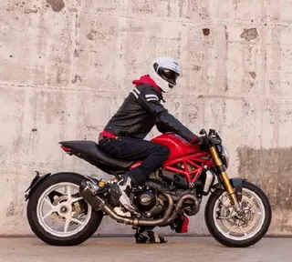 A rider on a red motorbike