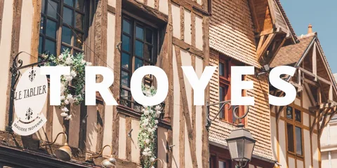 Half-timbered houses in Troyes, France, with the word Troyes across them